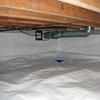 A heating duct extends along this sealed crawl space in Endicott.