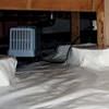 An energy efficient crawl space dehumidifier installed in a sealed crawl space in Walton.