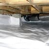 Bare floor joists in a sealed, insulated crawl space in Endicott.