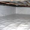 A crawl space vapor barrier has been installed on the walls and floors of this space in Newfield.