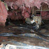 Fiberglass insulation dripping off some heating ducts in a wet crawl space in Newark Valley.