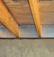 SilverGlo™ insulation installed in a floor joist in Windsor