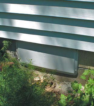 A gray crawl space vent cover in Trumansburg