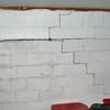 A buckling foundation wall in a Delhi home.