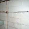 Severe foundation damage from a long crack in a bucking wall of a Pine City home.