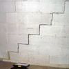 A diagonal stair step crack along the foundation wall of a Beaver Dams home