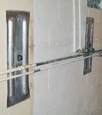 A foundation wall anchor system used to repair a basement wall in Delhi