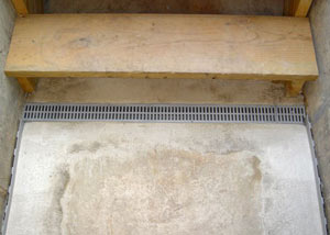 Our grated drain system installed on a leaking basement staircase in Willet.