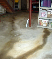 Flooding entering a basement through a floor crack in Owego