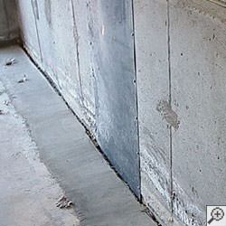 an ugly basement weeping tile drainage system that's clogged and not working in Johnson City.