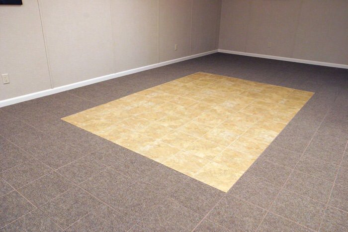 tiled and carpeted basement flooring installed in a Vestal home