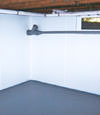 Elmira, NY wet basement wall covering that tucks into a perimeter drainage system